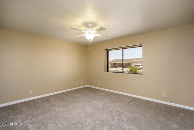 8230 E Navarro Ave, Mesa, AZ 85209 - carpeted spare room featuring a ceiling fan and baseboards