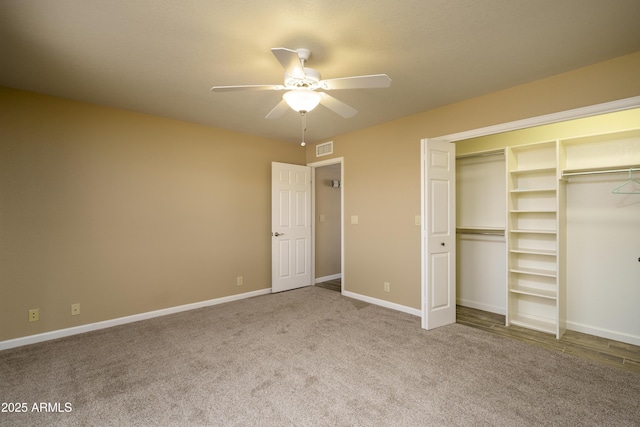 8230 E Navarro Ave, Mesa, AZ 85209 - unfurnished bedroom with carpet, baseboards, a ceiling fan, and a closet