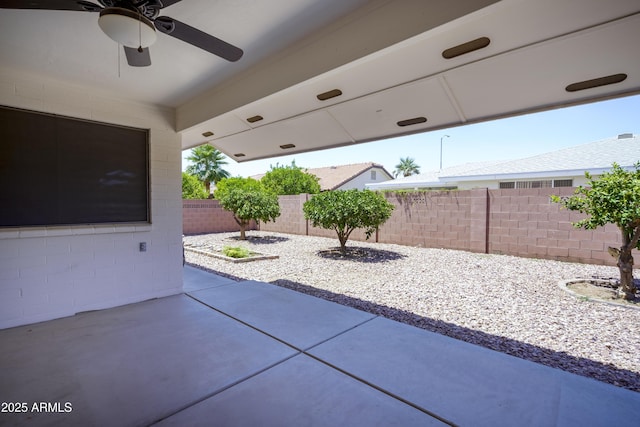 8230 E Navarro Ave, Mesa, AZ 85209 - fenced backyard featuring a ceiling fan and a patio area