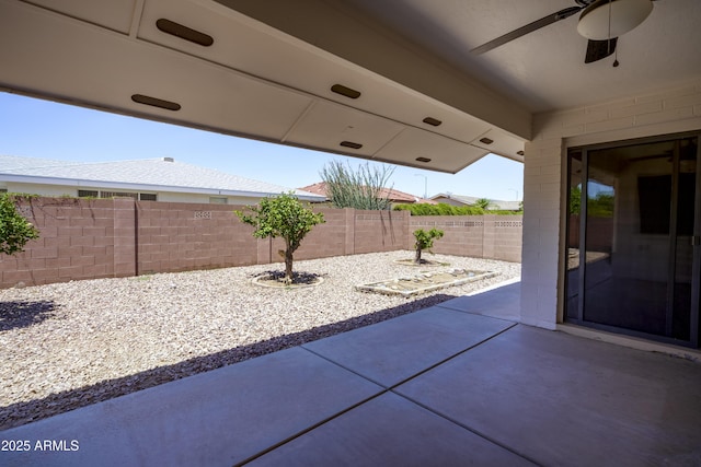 8230 E Navarro Ave, Mesa, AZ 85209 - fenced backyard featuring a ceiling fan and a patio area