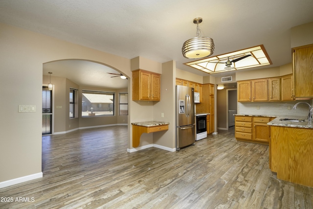 8230 E Navarro Ave, Mesa, AZ 85209 - kitchen featuring white appliances, a sink, light wood-style floors, light stone countertops, and baseboards