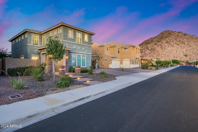 view of front of home featuring a mountain view and a garage