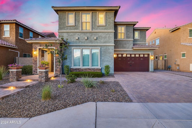 view of front of property with a garage