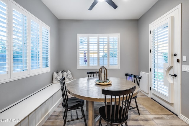 tiled dining area featuring ceiling fan and plenty of natural light