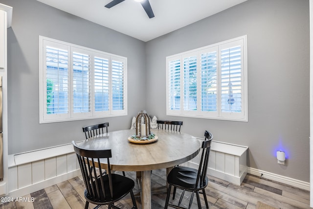 dining room with light hardwood / wood-style floors and ceiling fan