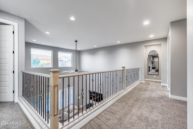 hallway featuring carpet flooring