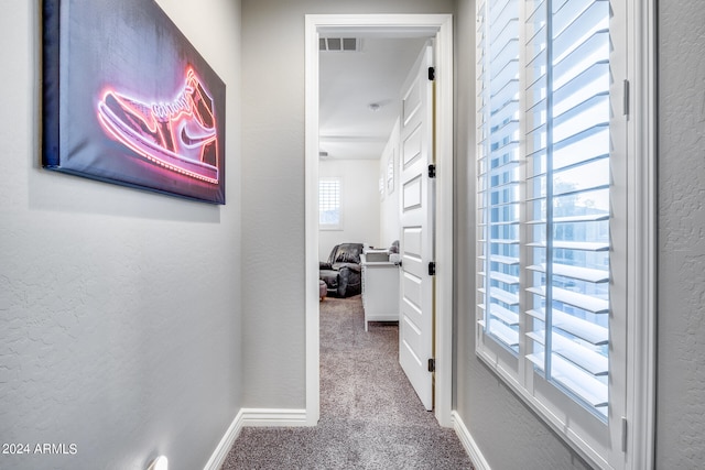 hallway with carpet