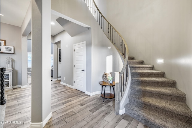 stairway featuring wood-type flooring