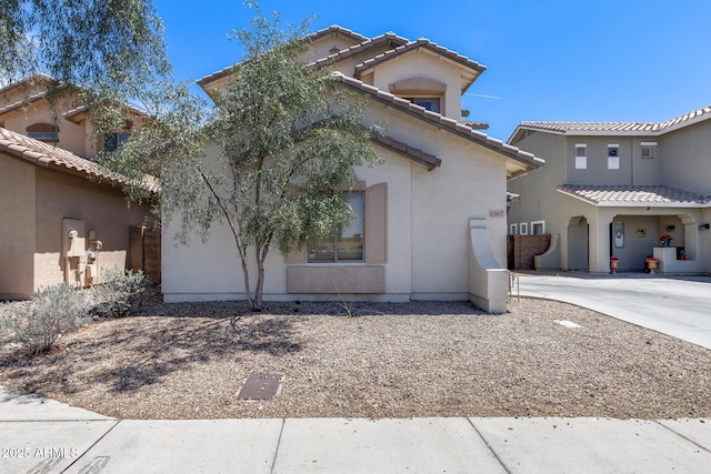 view of front of home with a tile roof and stucco siding