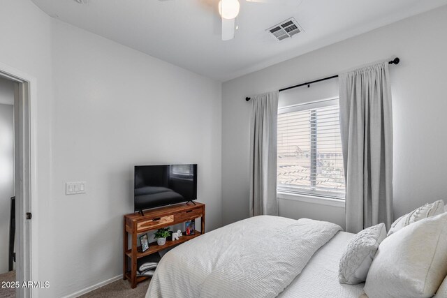 bedroom with visible vents, carpet flooring, baseboards, and ceiling fan