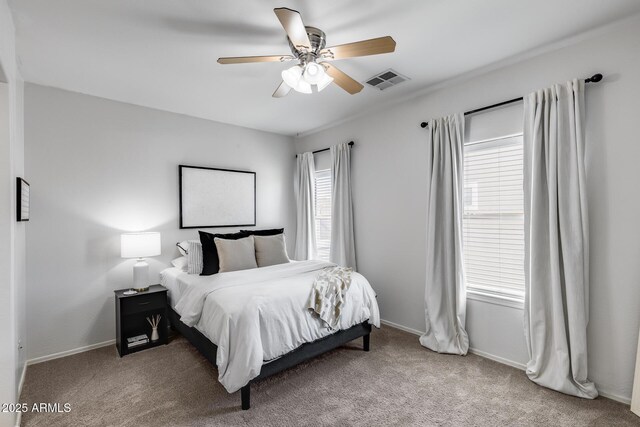 bedroom featuring visible vents, a ceiling fan, carpet, and baseboards