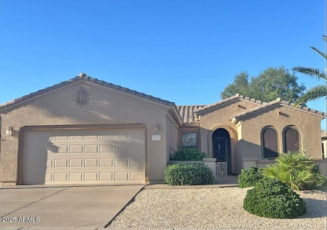 16412 W Peppertree Ct, Surprise, AZ 85387 - view of front facade featuring stucco siding, an attached garage, a tile roof, and driveway