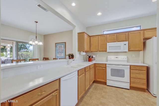 16412 W Peppertree Ct, Surprise, AZ 85387 - kitchen featuring white appliances, light countertops, decorative light fixtures, a chandelier, and recessed lighting
