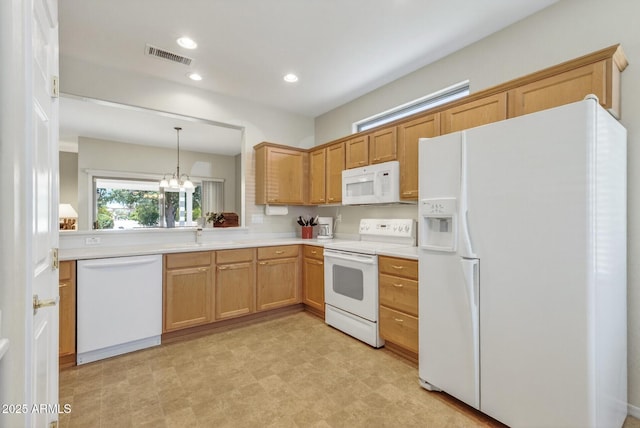 16412 W Peppertree Ct, Surprise, AZ 85387 - kitchen featuring white appliances, light countertops, a chandelier, recessed lighting, and decorative light fixtures
