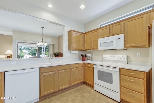16412 W Peppertree Ct, Surprise, AZ 85387 - kitchen with white appliances, a chandelier, light countertops, hanging light fixtures, and recessed lighting