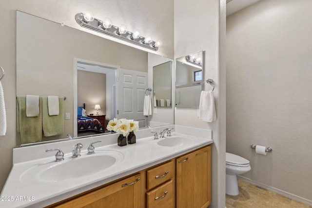 16412 W Peppertree Ct, Surprise, AZ 85387 - ensuite bathroom featuring double vanity and toilet