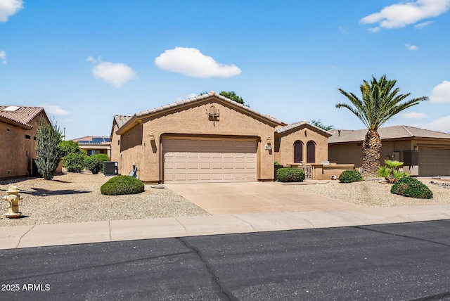 16412 W Peppertree Ct, Surprise, AZ 85387 - view of front of property with an attached garage, stucco siding, a tiled roof, and concrete driveway