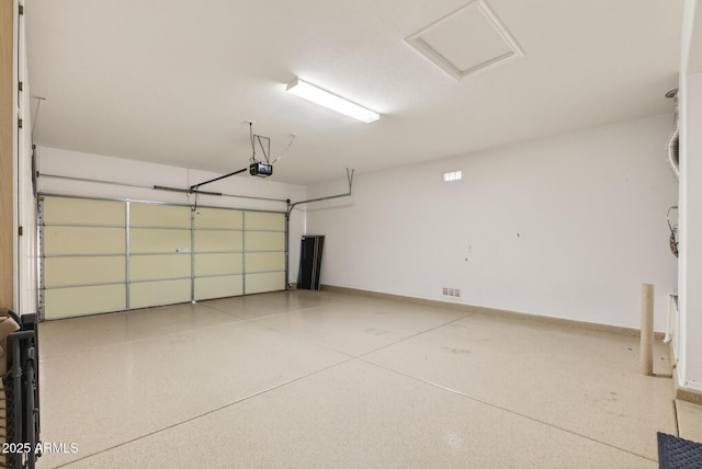 16412 W Peppertree Ct, Surprise, AZ 85387 - garage featuring a garage door opener and baseboards