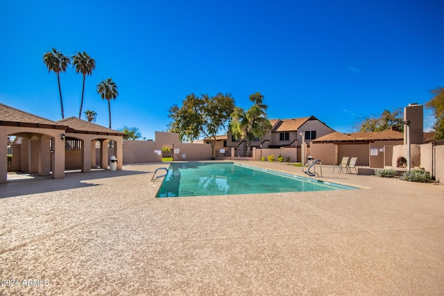 view of pool featuring a patio