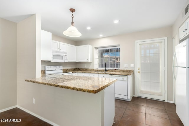 kitchen with white cabinetry, sink, hanging light fixtures, kitchen peninsula, and white appliances