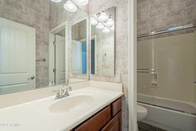 full bathroom with bathtub / shower combination, vanity, and toilet