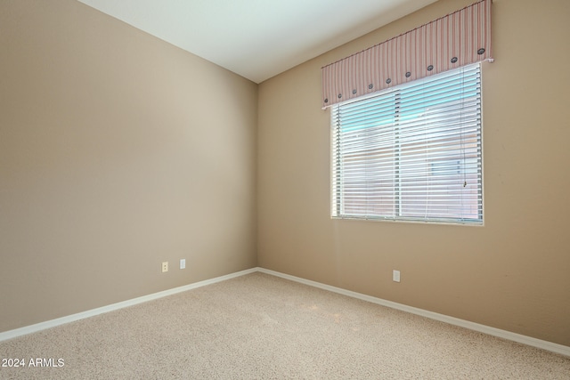 unfurnished room featuring carpet