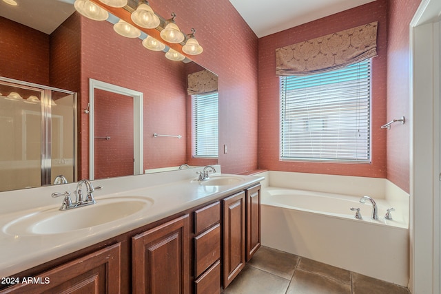 bathroom with tile patterned floors, vanity, and independent shower and bath