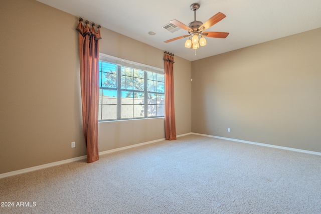 spare room featuring carpet and ceiling fan