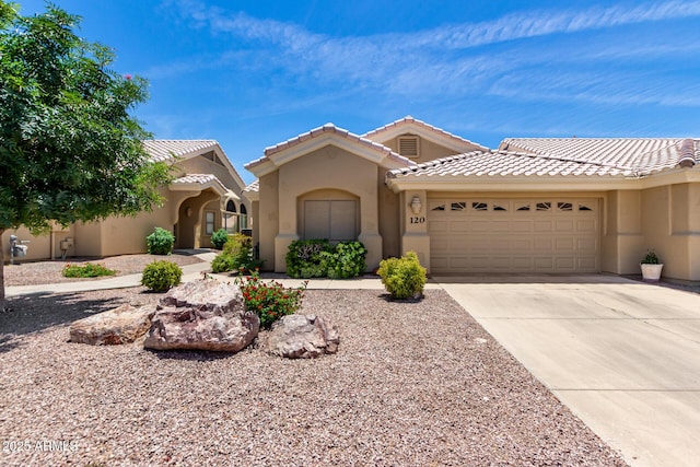 5830 E Mckellips Rd Unit 120, Mesa, AZ 85215 - mediterranean / spanish home with an attached garage, stucco siding, driveway, and a tiled roof