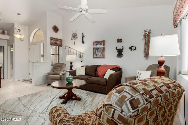 5830 E Mckellips Rd Unit 120, Mesa, AZ 85215 - living room with light tile patterned floors, ceiling fan, high vaulted ceiling, and baseboards