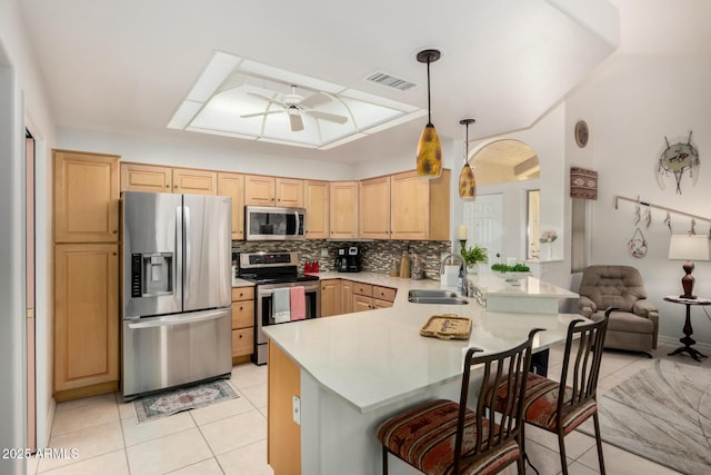 5830 E Mckellips Rd Unit 120, Mesa, AZ 85215 - kitchen with appliances with stainless steel finishes, a sink, a peninsula, ceiling fan, and light brown cabinets