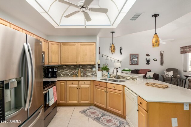 5830 E Mckellips Rd Unit 120, Mesa, AZ 85215 - kitchen with appliances with stainless steel finishes, a sink, ceiling fan, and a peninsula
