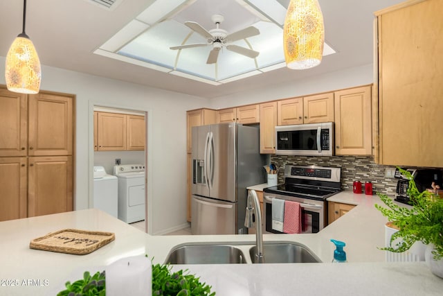 5830 E Mckellips Rd Unit 120, Mesa, AZ 85215 - kitchen with appliances with stainless steel finishes, independent washer and dryer, a sink, ceiling fan, and light countertops