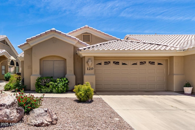 5830 E Mckellips Rd Unit 120, Mesa, AZ 85215 - view of front of house featuring a garage, concrete driveway, stucco siding, and a tile roof