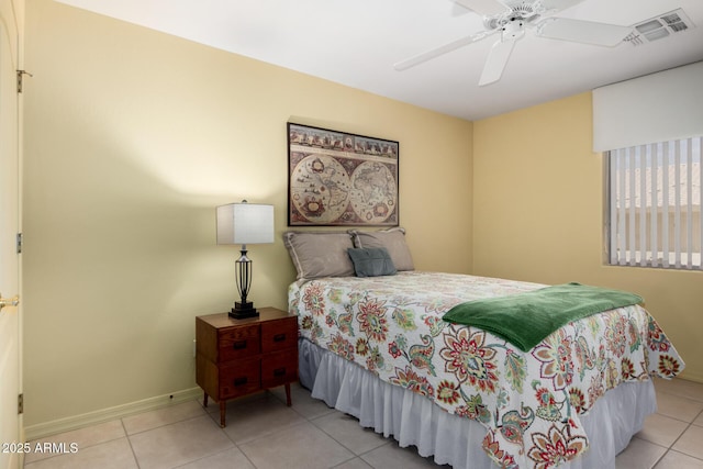 5830 E Mckellips Rd Unit 120, Mesa, AZ 85215 - tiled bedroom featuring baseboards and ceiling fan