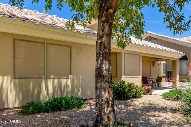 5830 E Mckellips Rd Unit 120, Mesa, AZ 85215 - property entrance with a tiled roof, stucco siding, and a patio