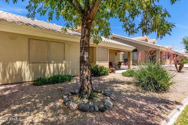 5830 E Mckellips Rd Unit 120, Mesa, AZ 85215 - view of front of home featuring a tiled roof, a patio area, and stucco siding