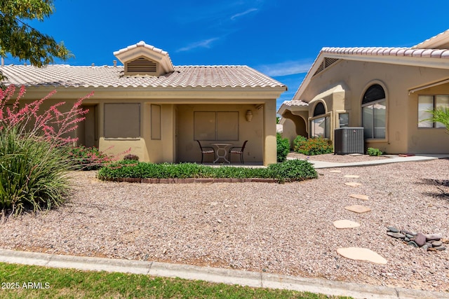 5830 E Mckellips Rd Unit 120, Mesa, AZ 85215 - view of side of home with a tiled roof, central air condition unit, and stucco siding