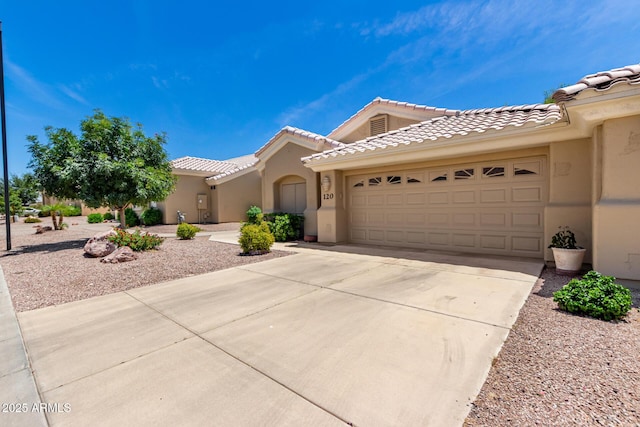 5830 E Mckellips Rd Unit 120, Mesa, AZ 85215 - view of front facade with concrete driveway, stucco siding, a garage, and a tiled roof