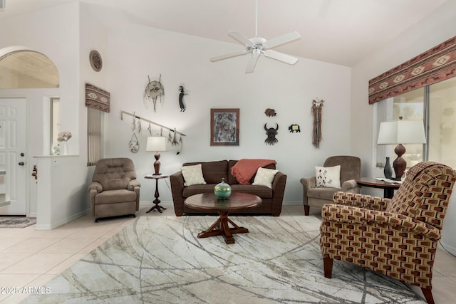 5830 E Mckellips Rd Unit 120, Mesa, AZ 85215 - tiled living area with lofted ceiling, arched walkways, ceiling fan, and baseboards
