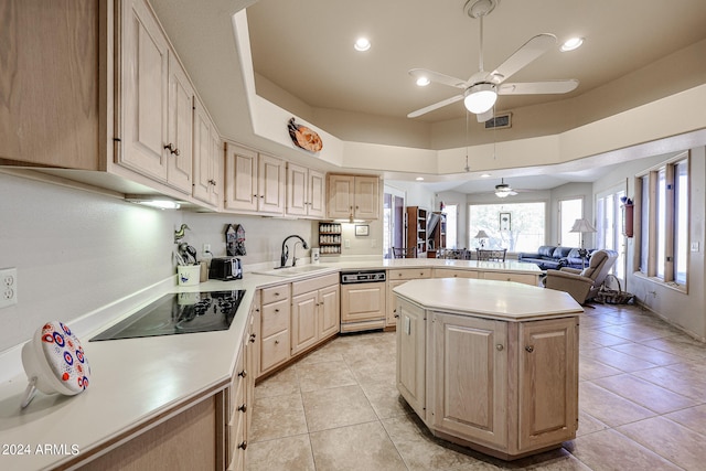 kitchen with a center island, light brown cabinets, sink, black electric cooktop, and light tile patterned flooring