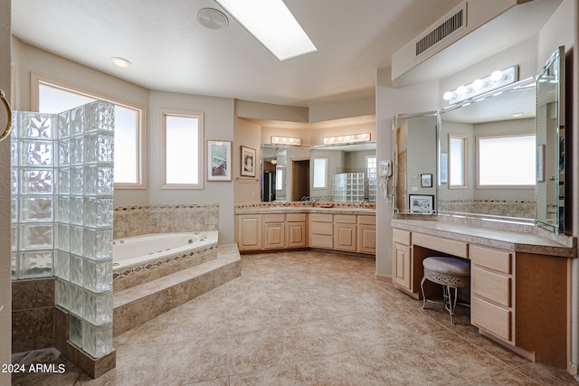 bathroom featuring tile patterned flooring, vanity, and independent shower and bath