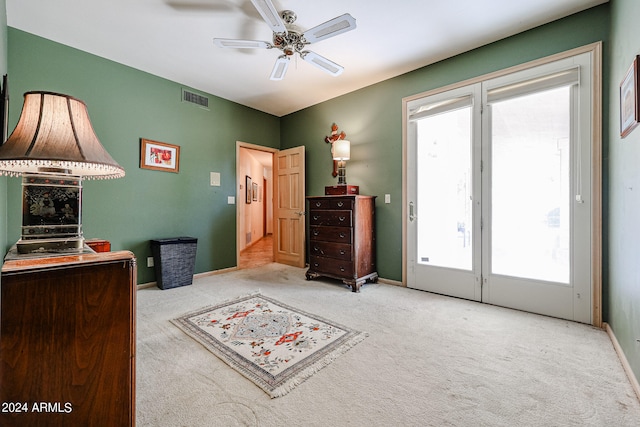 carpeted bedroom with ceiling fan