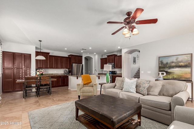 living room with sink and ceiling fan