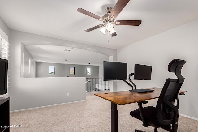 office space with light colored carpet and ceiling fan