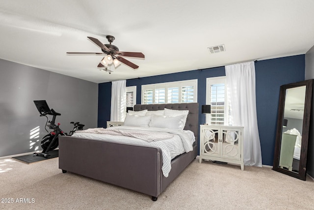 bedroom with light colored carpet and ceiling fan