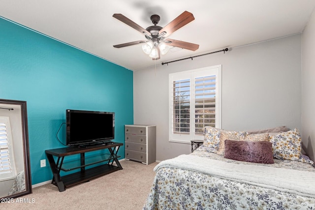 carpeted bedroom with multiple windows and ceiling fan