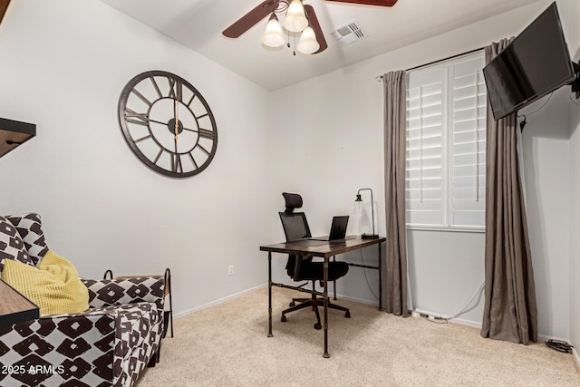 carpeted office featuring ceiling fan