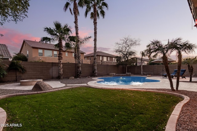 pool at dusk featuring a fire pit, a patio area, pool water feature, and a lawn