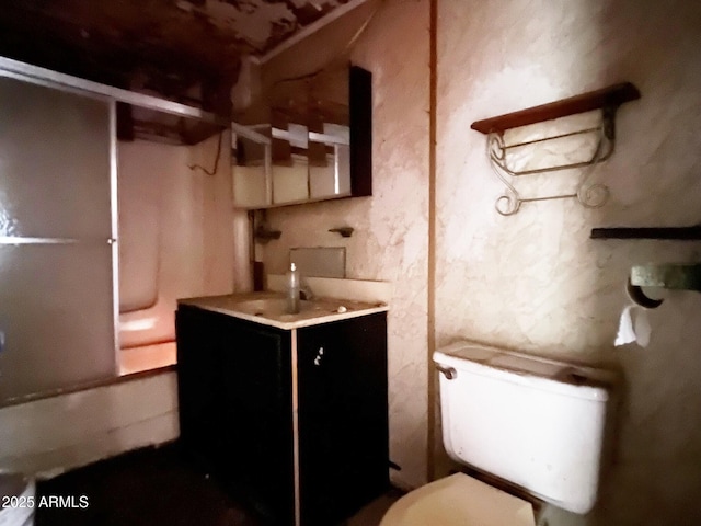 full bath featuring washtub / shower combination, vanity, and toilet